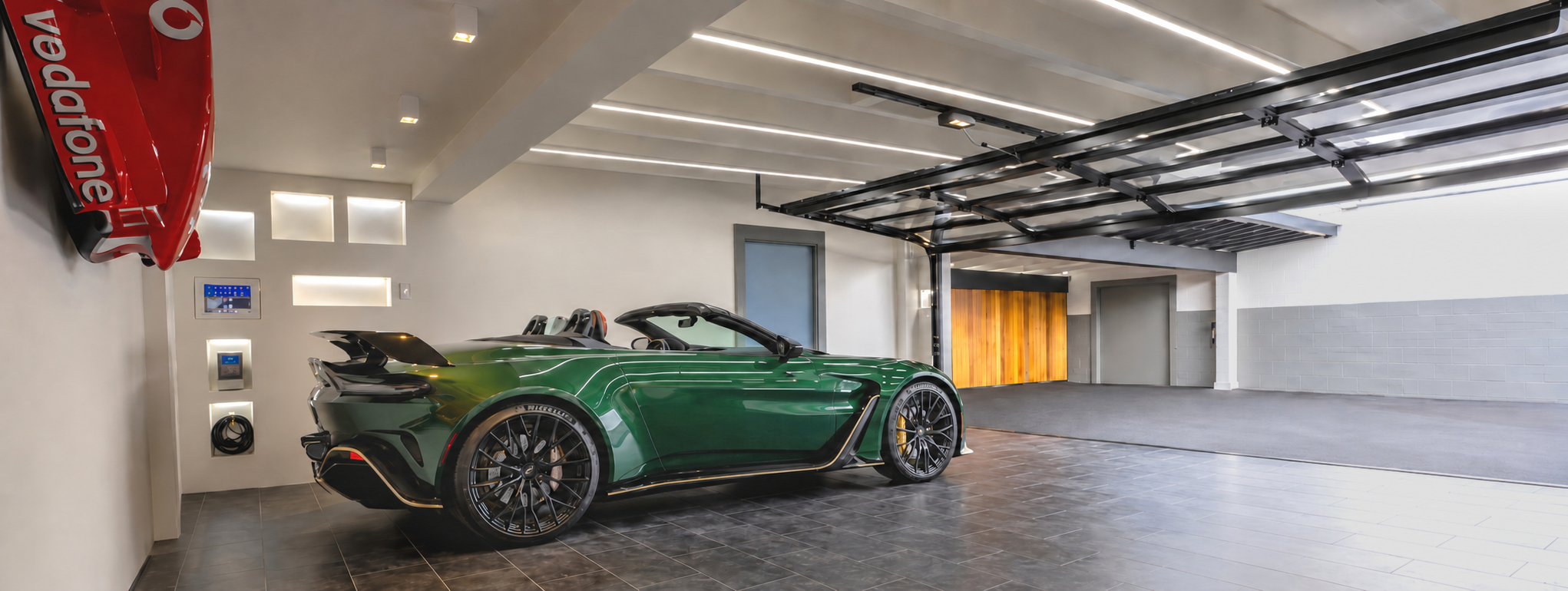 Rear and side view of green collector car in the vehicle gallery
